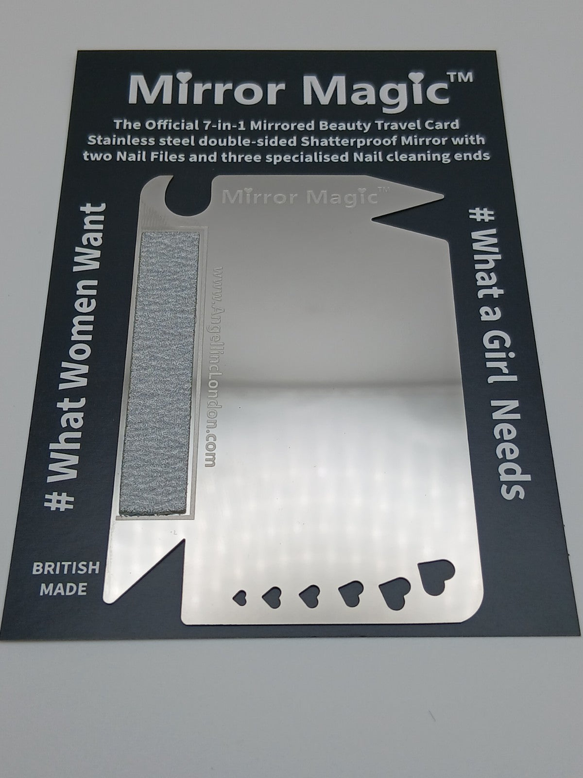 Mirror Magic travel card with mirror and nail files on a gray background