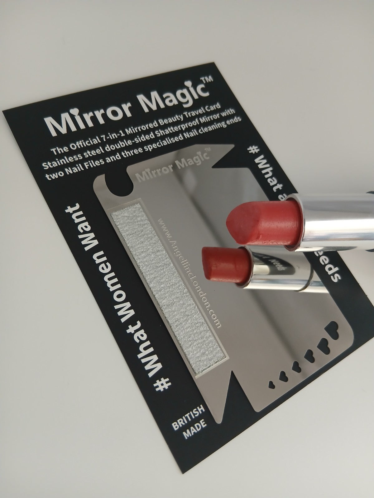 Mirror Magic card with two lipsticks on a white background