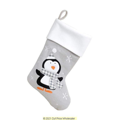 Gray Christmas stocking with a penguin design on a white background