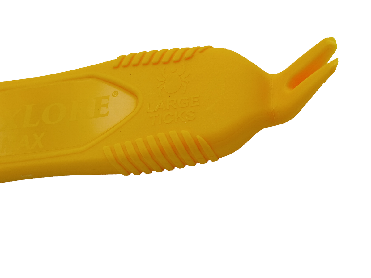 Close-up of the VuxLore MAX tick remover’s large-tick end, showing the wider forked tip, moulded large ticks label and ridged grips.