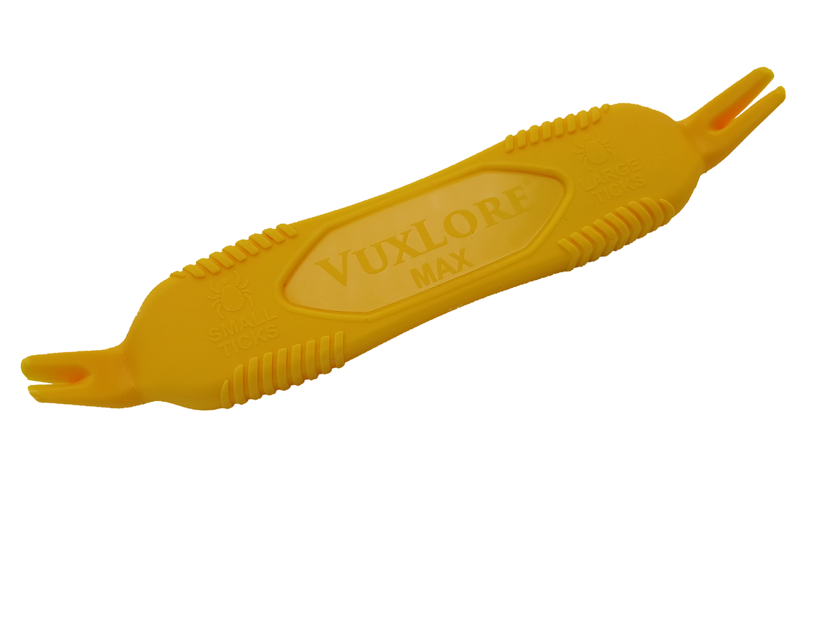 Angled view of the yellow VuxLore MAX tick remover, showing its ridged handle and dual-ended forked tips labelled for small and large ticks.